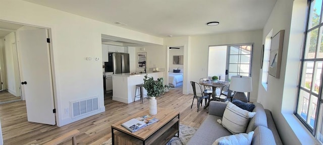 742 Eastshore Unit 98, Chula Vista, CA 91913 - living room with light wood-type flooring and baseboards