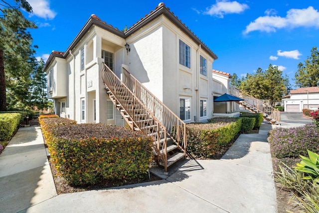 742 Eastshore Unit 98, Chula Vista, CA 91913 - view of property featuring stairway