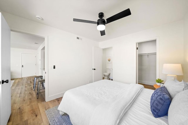 742 Eastshore Unit 98, Chula Vista, CA 91913 - bedroom with light wood-type flooring, baseboards, a ceiling fan, a closet, and ensuite bathroom