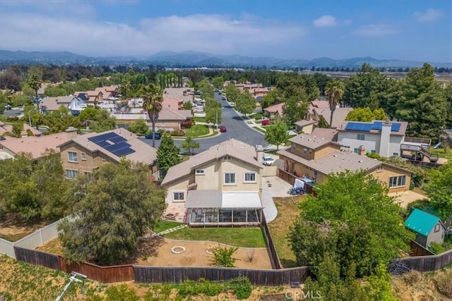 drone / aerial view with a residential view and a mountain view