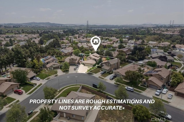 birds eye view of property with a residential view and a mountain view