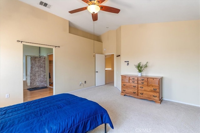 bedroom with baseboards, a high ceiling, carpet, and visible vents