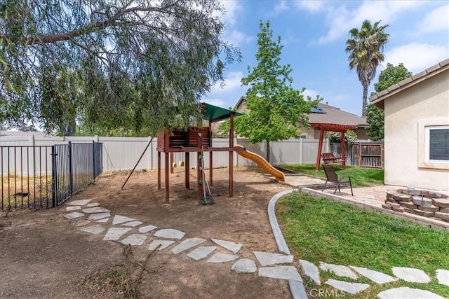 view of jungle gym with a fenced backyard