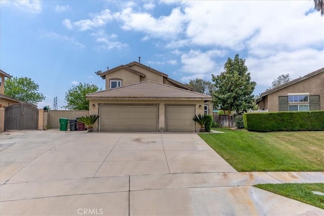 view of front of property featuring fence, stucco siding, a front yard, a gate, and driveway