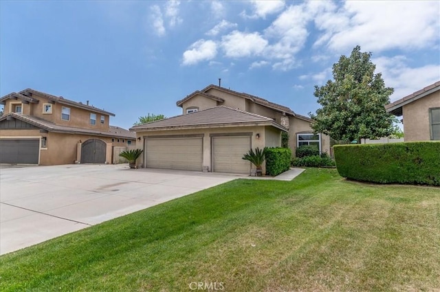 mediterranean / spanish home featuring fence, a front lawn, a garage, stucco siding, and driveway