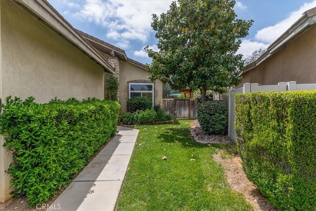 view of yard with fence