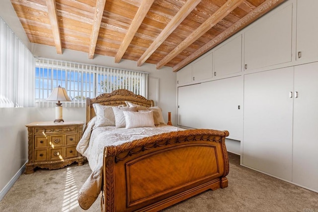 bedroom featuring vaulted ceiling with beams, wood ceiling, and light carpet
