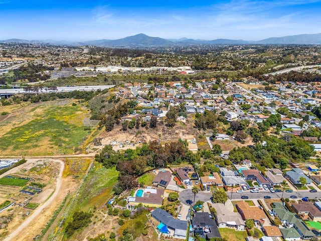 aerial view with a mountain view and a residential view