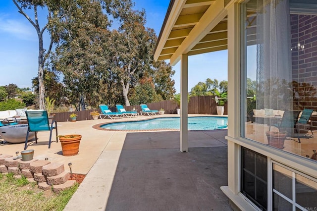 view of swimming pool with a fenced in pool, a patio, and a fenced backyard
