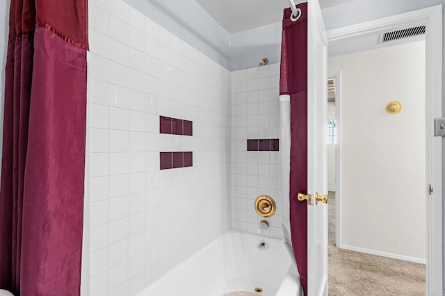 full bathroom with visible vents and baseboards