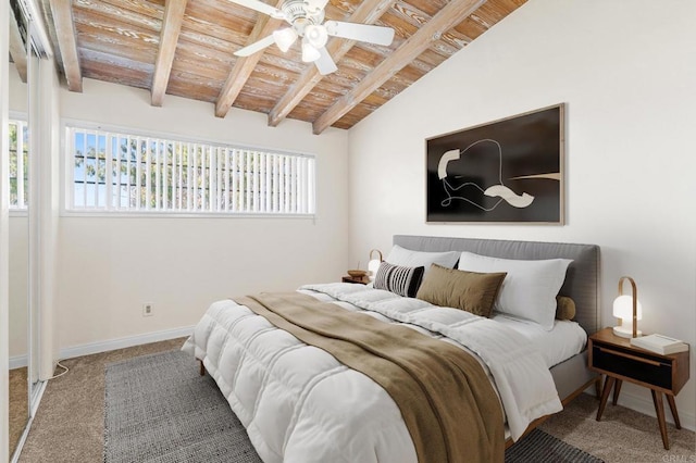 carpeted bedroom featuring vaulted ceiling with beams, baseboards, multiple windows, and wooden ceiling