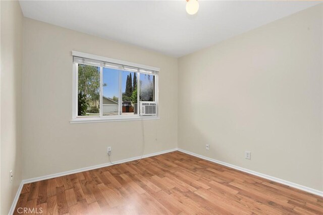 766 Harper St, Simi Valley, CA 93065 - unfurnished room with wood finished floors, baseboards, and cooling unit