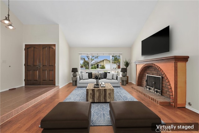 766 Harper St, Simi Valley, CA 93065 - living room featuring a fireplace, wood finished floors, high vaulted ceiling, and baseboards