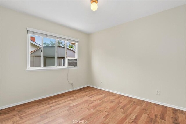 766 Harper St, Simi Valley, CA 93065 - empty room with light wood-style flooring, baseboards, and cooling unit