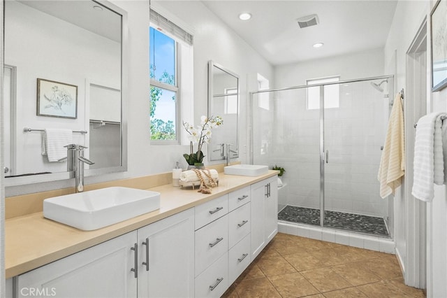 15 Clover, Lake Forest, CA 92630 - bathroom featuring double vanity, a shower stall, tile patterned floors, and recessed lighting