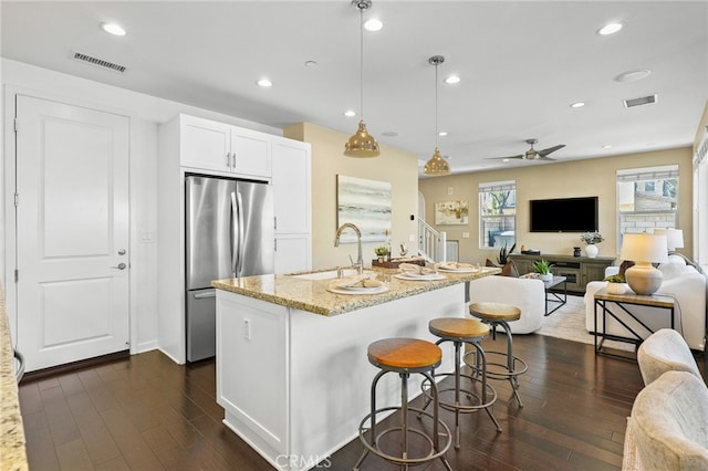 15 Clover, Lake Forest, CA 92630 - kitchen featuring freestanding refrigerator, dark wood finished floors, light stone counters, a sink, and open floor plan