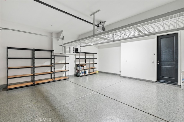 15 Clover, Lake Forest, CA 92630 - garage featuring baseboards and a garage door opener