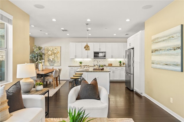 15 Clover, Lake Forest, CA 92630 - living room featuring dark wood finished floors, recessed lighting, and baseboards