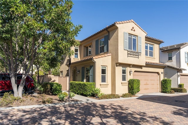 15 Clover, Lake Forest, CA 92630 - view of front of property with a tile roof, a garage, stucco siding, and decorative driveway