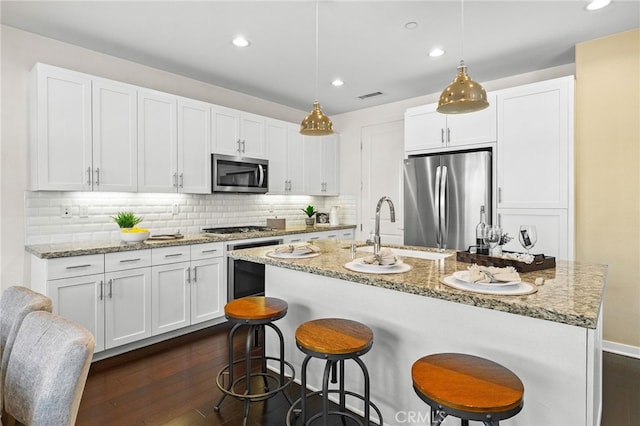 15 Clover, Lake Forest, CA 92630 - kitchen featuring appliances with stainless steel finishes, a sink, dark wood-style floors, recessed lighting, and white cabinetry