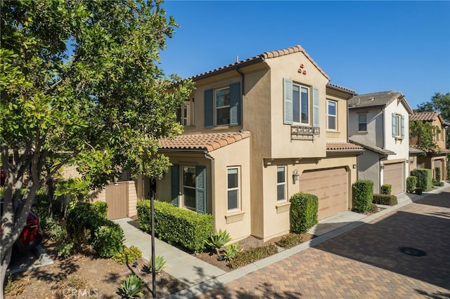 15 Clover, Lake Forest, CA 92630 - view of front facade with a tile roof, a garage, stucco siding, and decorative driveway