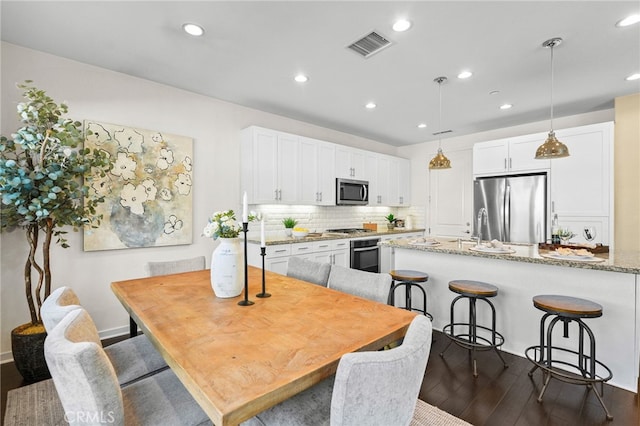 15 Clover, Lake Forest, CA 92630 - dining space featuring dark wood-type flooring and recessed lighting