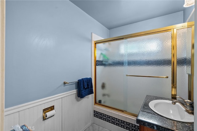 9438 Burnet Ave, North Hills, CA 91343 - bathroom with a shower with door, a wainscoted wall, and vanity