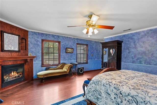 9438 Burnet Ave, North Hills, CA 91343 - bedroom with visible vents, crown molding, wood finished floors, and a large fireplace
