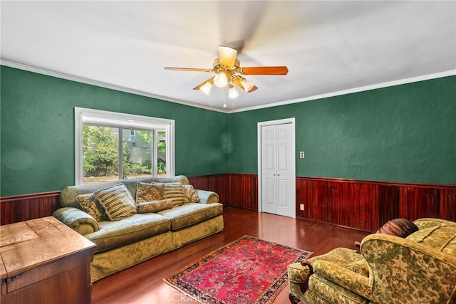 9438 Burnet Ave, North Hills, CA 91343 - living room featuring ceiling fan, wainscoting, wood walls, and wood finished floors
