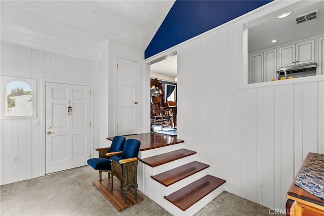 9438 Burnet Ave, North Hills, CA 91343 - entrance foyer with vaulted ceiling, plenty of natural light, concrete flooring, and visible vents