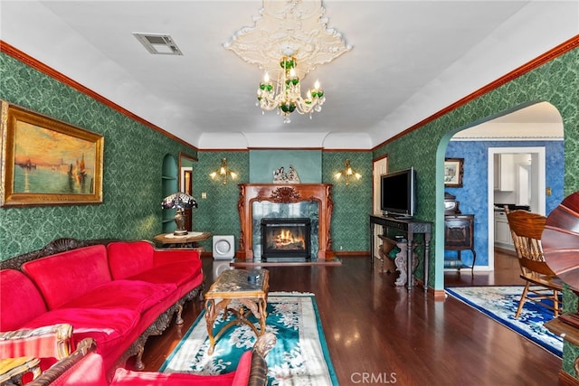 9438 Burnet Ave, North Hills, CA 91343 - living area with visible vents, wood finished floors, wallpapered walls, a chandelier, and arched walkways