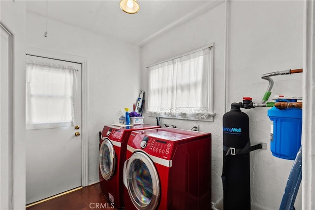 9438 Burnet Ave, North Hills, CA 91343 - laundry room with plenty of natural light, laundry area, dark wood-style flooring, and washing machine and clothes dryer