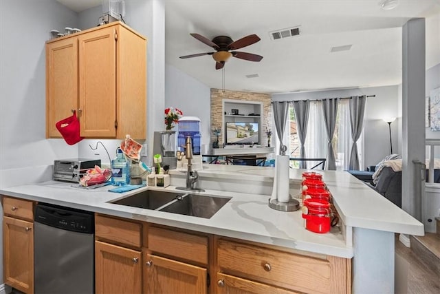 kitchen with stainless steel dishwasher, visible vents, open floor plan, ceiling fan, and light countertops