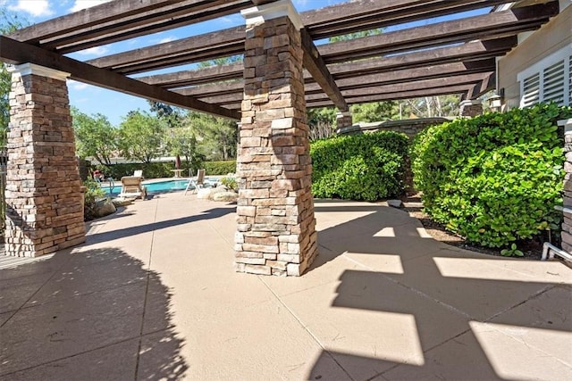 view of patio / terrace featuring a community pool and a pergola