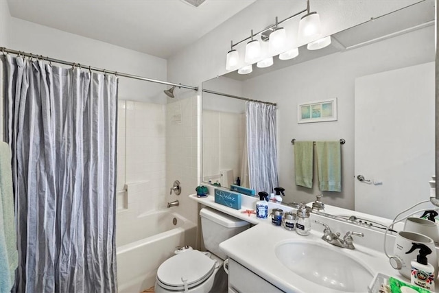 bathroom featuring vanity, toilet, and shower / tub combo