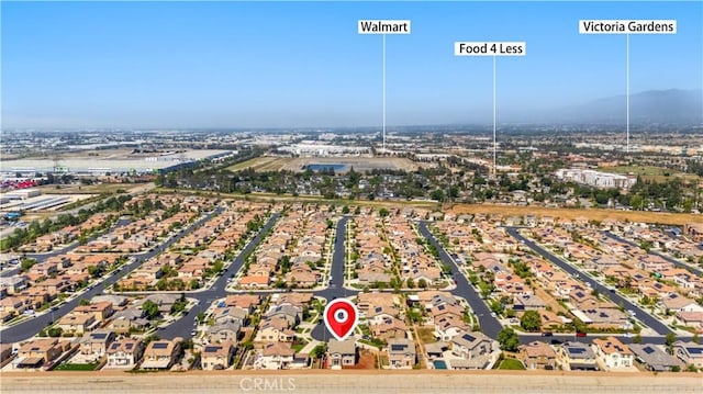 aerial view of residential area featuring mountains