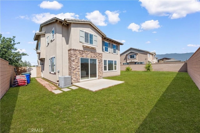 back of property featuring stucco siding, cooling unit, and a patio