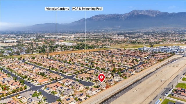 aerial view of residential area with a mountainous background