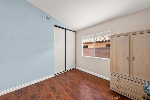 11820 Mount Wilson Ct, Rancho Cucamonga, CA 91737 - unfurnished bedroom featuring visible vents, dark wood finished floors, baseboards, a closet, and lofted ceiling