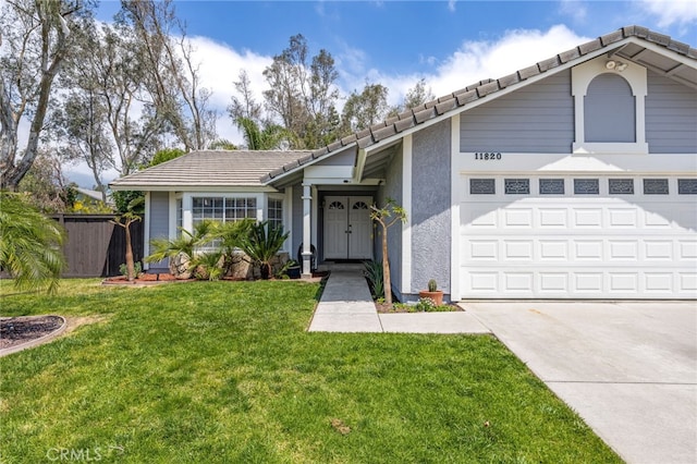 11820 Mount Wilson Ct, Rancho Cucamonga, CA 91737 - view of front facade featuring fence, stucco siding, a front yard, a tiled roof, and driveway