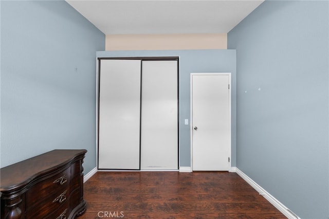 11820 Mount Wilson Ct, Rancho Cucamonga, CA 91737 - unfurnished bedroom with baseboards, dark wood finished floors, and a closet