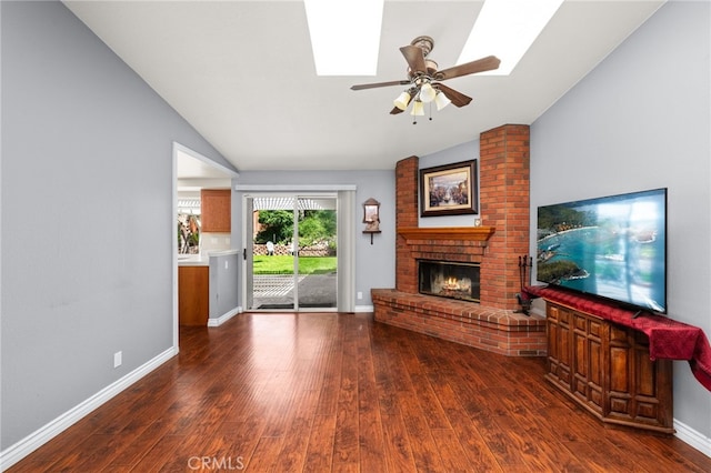 11820 Mount Wilson Ct, Rancho Cucamonga, CA 91737 - unfurnished living room featuring a ceiling fan, wood finished floors, lofted ceiling with skylight, and a fireplace