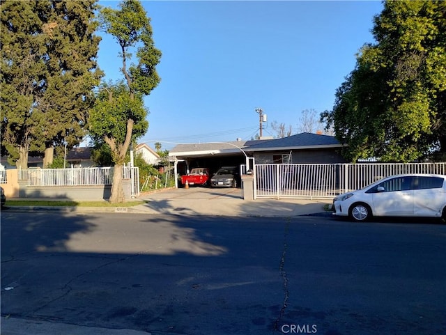 manufactured / mobile home featuring fence and a carport
