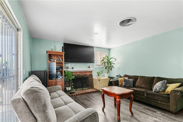 12036 Jouett St, Sylmar, CA 91342 - living room with wood finished floors and a fireplace