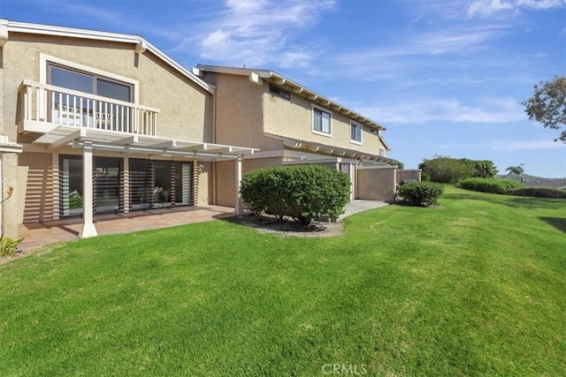 413 Avenida Adobe, San Clemente, CA 92672 - rear view of property with a pergola, a lawn, stucco siding, and a balcony