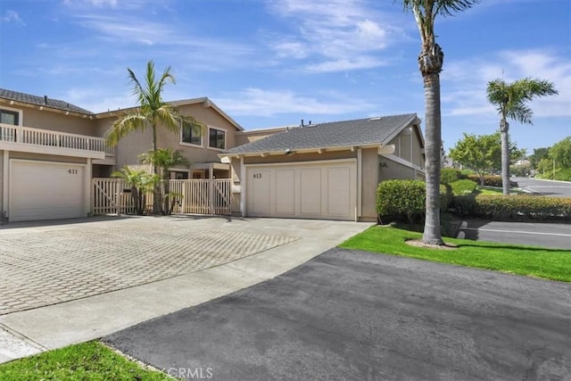 413 Avenida Adobe, San Clemente, CA 92672 - view of front of house with asphalt driveway, stucco siding, and an attached garage