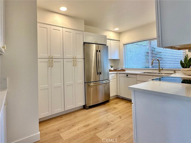 413 Avenida Adobe, San Clemente, CA 92672 - kitchen with freestanding refrigerator, white dishwasher, light wood finished floors, light countertops, and recessed lighting
