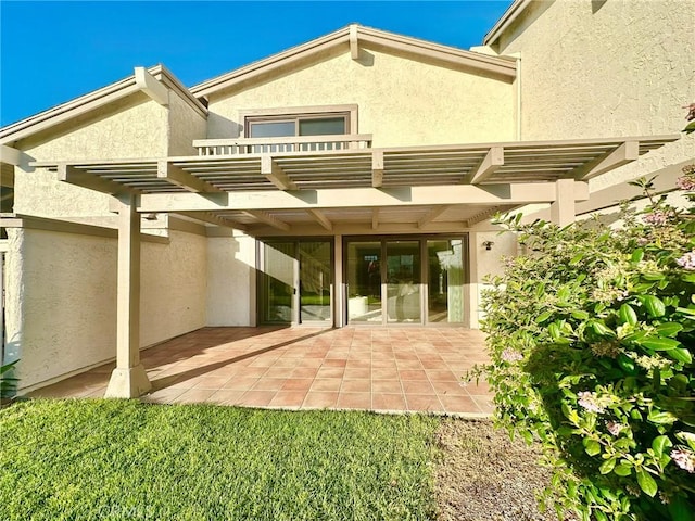 413 Avenida Adobe, San Clemente, CA 92672 - rear view of house featuring a pergola, stucco siding, a patio, and a balcony