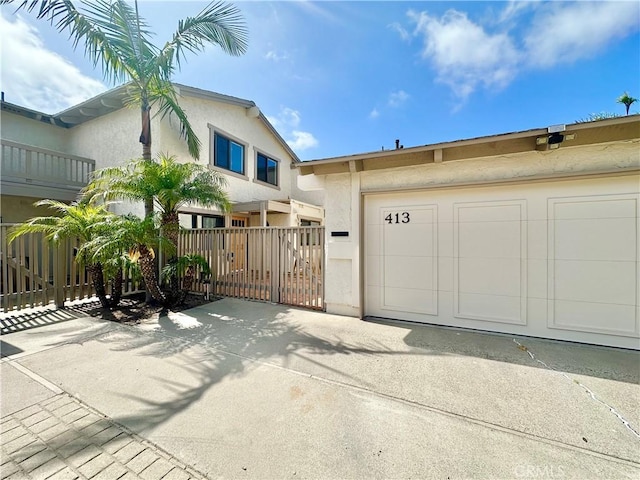 413 Avenida Adobe, San Clemente, CA 92672 - view of front of home featuring a garage and stucco siding