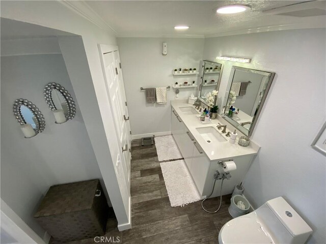 22272 Redwood Pointe Unit 5C, Lake Forest, CA 92630 - bathroom with a sink, wood finished floors, ornamental molding, toilet, and baseboards